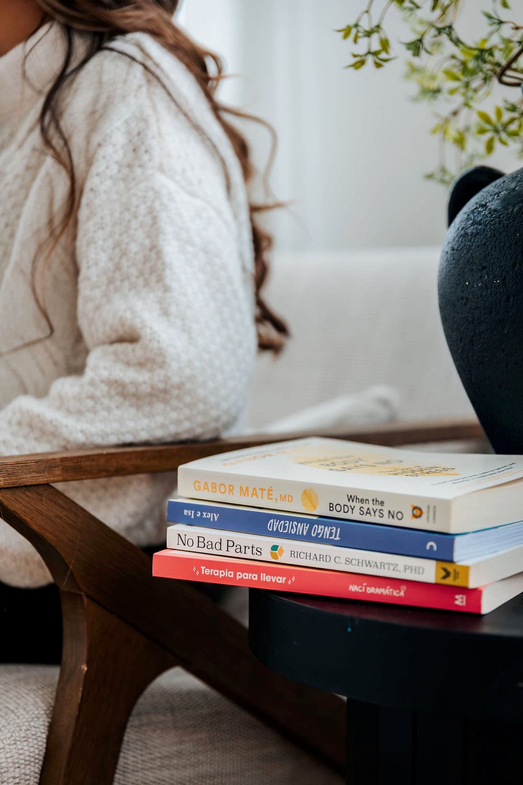 Therapy books on a side table in a welcoming space